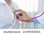 Health care concept medical and diagnosis. Close up doctor using stethoscope physical examination of the patient listening to the respiratory system and lungs.
