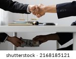 Business people shaking hands and Give an under-the-table bribe to an attorney to help a lawyer win a court case. Bribery and Kickback Ideas Fraud and Fraud