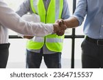Small photo of Collaboration of engineers, architects and contractors. Architects hand in hand promote teamwork cooperation of colleagues in construction projects.