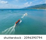 Aerial Of A Speedboat Towing A...