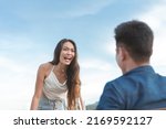 Small photo of An irate woman screams and vents out her emotion to her boyfriend. A public outburst of frustration an anger over a relationship.