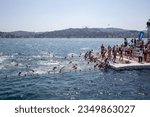 Small photo of ISTANBUL, TURKEY - 2023.08.20: Swimmers at the 35th Samsung Bosphorus Intercontinental Swimming Race. Organized by the National Olympic Committee of Turkey, the 6.5-kilometer race.
