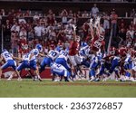 Small photo of Sept 16, 2023:NCAA Football, BYU 38:31 Ark- Cougars K Will Ferrin (44) kick a fieldgoal as Razorbacks try to block during the game at Razorback Stadium, Fayetteville, AR.