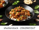 Small photo of Crispy cashew Chicken stir fry with rice. Asian take away food