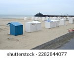 Small photo of Blankenberge, West-Flanders, Belgium - March 29, 2023: start of the log season. The beach cabins reappear on the beach