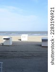 Small photo of Blankenberge, West-Flanders, Belgium - March 30, 2023: end winter. Springtime is the start of the log season. The beach cabins reappear on the beach