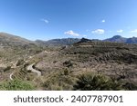 Small photo of Agricultural landscape near Tarbena, with almond trees on terraced hillside and Bernie mountain range beyond, Alicante Province, Valencia, Spain