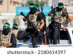 Small photo of Masked members of the al-Qassam Brigades, the military wing of Hamas, during a march on the 8th anniversary of the kidnapping of the Israeli soldier Shaul Aron in 2014, Gaza City, on July 20, 2022.