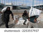Small photo of Palestinians receive their food rations from the United Nations Relief and Works Agency (UNRWA) warehouse, in in the southern Gaza Strip town of Rafah, on January 22, 2023.