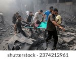 Small photo of Palestinians look for survivors after an Israeli airstrike in Rafah refugee camp, southern Gaza Strip, on October 12 2023.