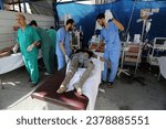 Small photo of The wounded Palestinians arrive at Al-Najjar Hospital after an Israeli raid on their home in the city of Rafah, southern of Gaza Strip, on October 22, 2023.