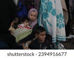 Small photo of Displaced Palestinians coming from Jabalia Camp and Beit Hanoun to stay in the government shelter school in the city of Rafah, southern of the Gaza Strip, on November 30, 2023.