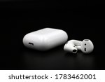 Air Pods. with Wireless Charging Case. New Airpods 2019 on black background. Airpods.EarPods.
