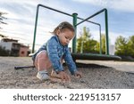 Small photo of One girl small caucasian child female toddler 18 months old in park play in day by speedy spinner merry-go-round turnabout childhood and growing up concept copy space