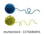 Blue and green woolen balls over white background. Two balls of wool partially unrolled. 