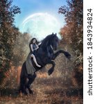 Small photo of Barbarian girl astride a rearing black Friesian horse