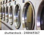 laundromat machine washer line with closed doors (shallow depth of field)