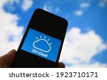 Small photo of Viersen, Germany - February 9. 2021: Closeup of smartphone with logo lettering of cloud computing provider service ibm, blurred sky and cloud background (focus on white cloud logo upper part)