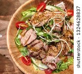 spicy roasted pork salad | Shutterstock . vector #1324628837