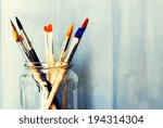Photo Of Paint Brushes In A Jar