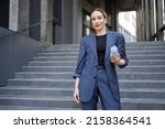 Business woman with folded Whatman paper in her hand
