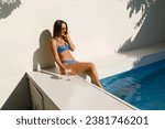Bikini Babe Chatting by the Water