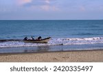 Small photo of Cartagena, Bolivar Colombia - February 1, 2024: fishing in Cartagena, Colombia. The boat arrives on the beach with the tip of the trammel net extended out to sea.