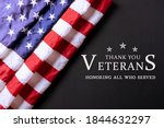 American flag on black background with text. Happy Veterans Day.