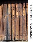 Small photo of Detail of the Kvikne Stave Church, a cruciform church dating from 1764 in the municipality of Nord-Fron in Oppland county, Norway. Wooden tarry wall.