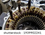 Small photo of Stator of an IPM-SynRM (Internal Permanent Magnet Synchronous Reluctance Motor) motor of an moder electric vehicle. EV maintenance, service; repair concept
