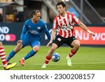 Small photo of ROTTERDAM, NETHERLANDS - MAY 6 2023: Xavi Simons of PSV battles for the ball with Dirk Abels of Sparta Rotterdam during the match between Sparta Rotterdam and PSV at Sparta Stadion