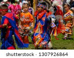 Small photo of Six Nations near Brantford, Ontario, Canada - July 25, 2010: Young children Native Indian dancers in tiny tots competition at a Grand River Pow Wow