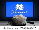 Small photo of Cali, Colombia - June 7, 2022: Paramount Plus app on tv screen behind a bowl of popcorn and a remote control. Paramount Plus is an online video streaming subscription service.