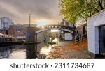 Small photo of Birmingham, UK - October 31, 2022: Sunrise light on the canal interchange at Gas Street, Birmingham, UK