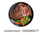 Small photo of Barbecue grilled and sliced wagyu Rib Eye beef meat steak on a plate. Isolated on white background
