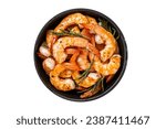 Roast Prawns Shrimps in a pan with herbs and garlic. Isolated, white background. Top view
