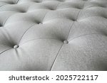 Soft focus Luxury grey sofa leather cushion for textured pattern background.                               