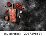 Salami Milano sliced sausage set, on black dark stone table background, top view flat lay, with copy space for text