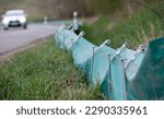 Small photo of A green plastic toad fence is erected at the roadside. This is to prevent the toads from running over.