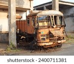 Small photo of Baharagora,Jharkhand - December 10,2023:A rusted truck, a silent relic of bygone days, weathered by time, narrating stories of its former glory amidst a desolate setting.