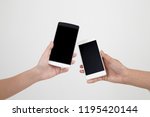close up of two hands  holding smart phone