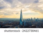 Small photo of Panoramic sunset view from Sky Garden, London, featuring the Shard building amidst the cityscape. Urban beauty at dusk