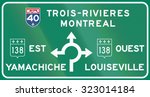 Guide and information road sign in Quebec, Canada - Roundabout with directions. Ouest means west, est means east.