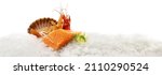 Small photo of Raw Salmon Fillet Steak with Tiger Prawns, Gamba Carabinero and Shrimp on Ice isolated on white Background