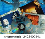 Small photo of HAMBURG, GERMANY, January 22 - 2024: Music exhibition - Nevermind Album Nirvana CD - Grunge Music Kurt Cobain and Band