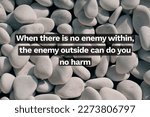 Inspirational life quote on blurry background. When there is no enemy within, the enemy outside can do you no harm.
