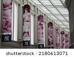 Small photo of Bronx, New York, USA - June 12, 2022: Banners of famous New York Yankees players on display at the interior concourse of Yankee Stadium