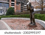 Small photo of Tuscaloosa, AL - December 2020: A statue of national championship winning football coach Nick Saban outside of Bryant-Denny Stadium on the campus of The University of Alabama on an overcast day.