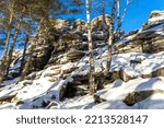 Small photo of Small Devils Rock, Devil's Hillfort or Devil's Settlement or Mound or City complex on sunny, cloudless winter day. Iset Park, Iset village, Sverdlovsk region, Russia. Hiking.