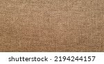 Small photo of Rough burlap texture, canvas coarse cloth, dark brown woven rustic bagging. Natural hessian jute, beige textile texture. Linen fabric pattern. Threads background. Sackcloth surface, sacking material.